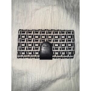 Bally monogram continental wallet with a black leather snap closure black cream